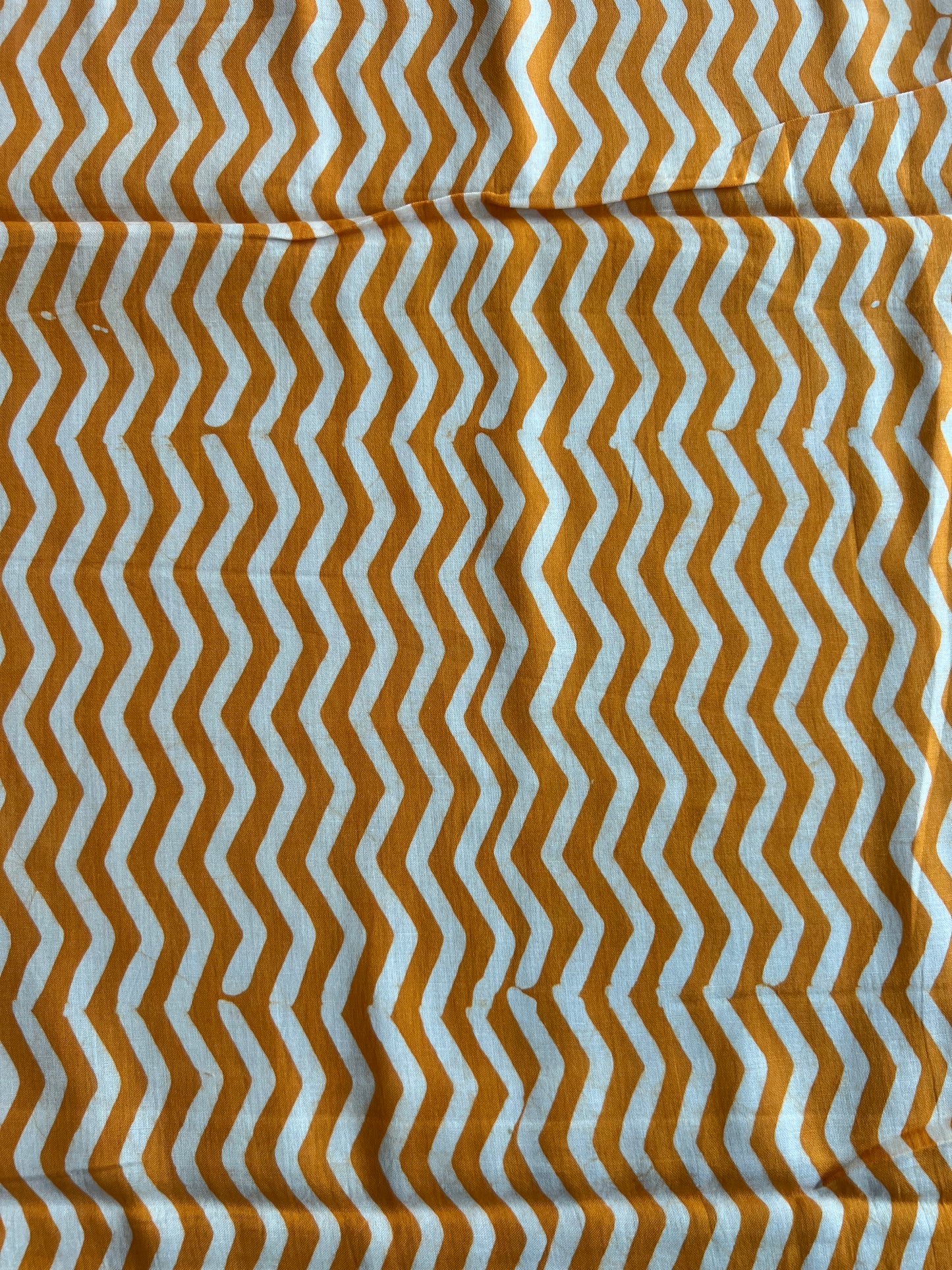 Mustard Geometrical Printed Batik Glace Cotton Fabric