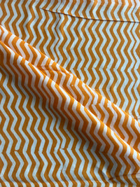 Mustard Geometrical Printed Batik Glace Cotton Fabric