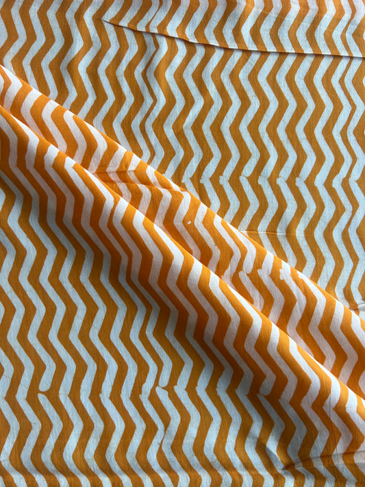 Mustard Geometrical Printed Batik Glace Cotton Fabric