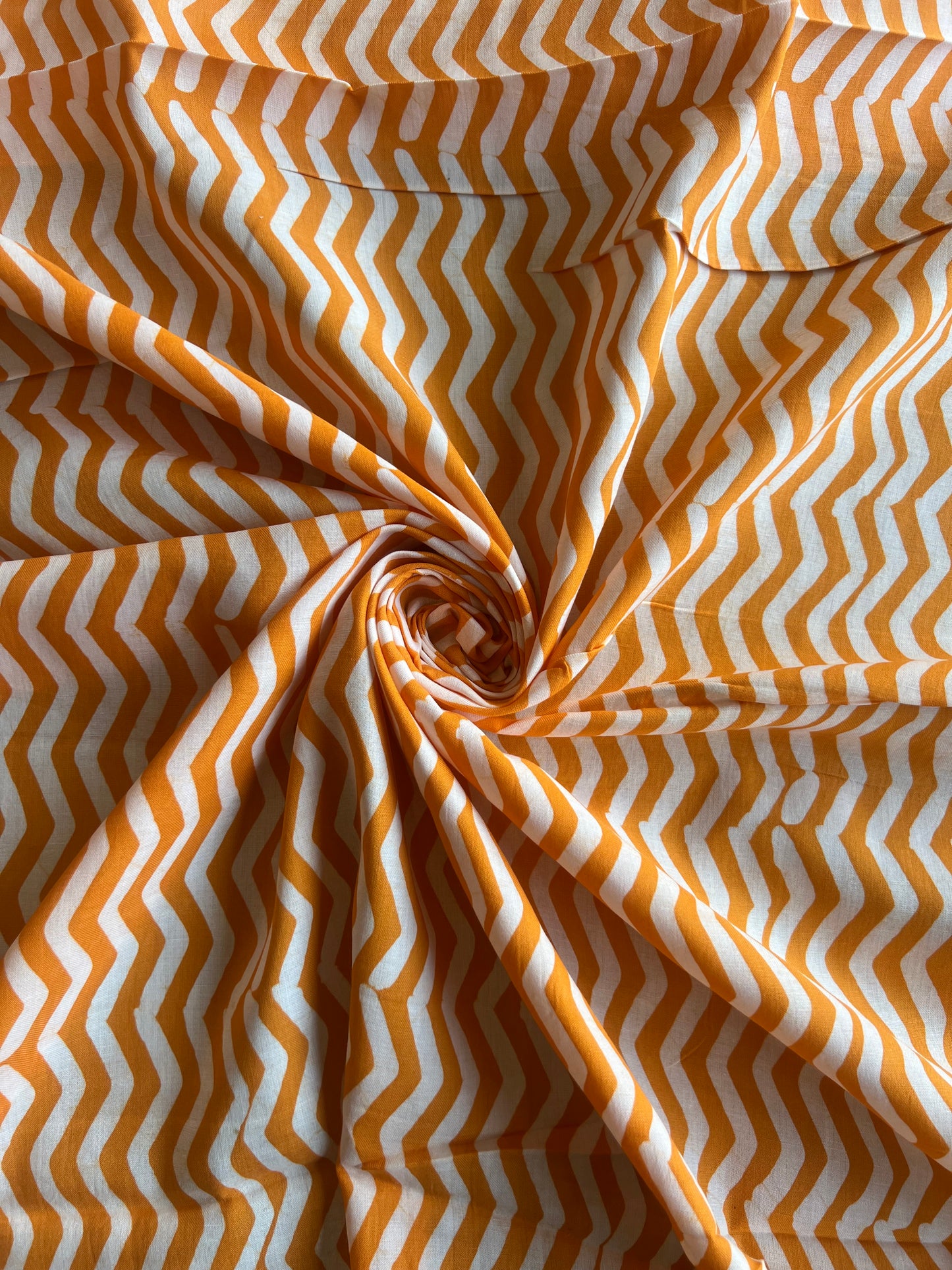 Mustard Geometrical Printed Batik Glace Cotton Fabric