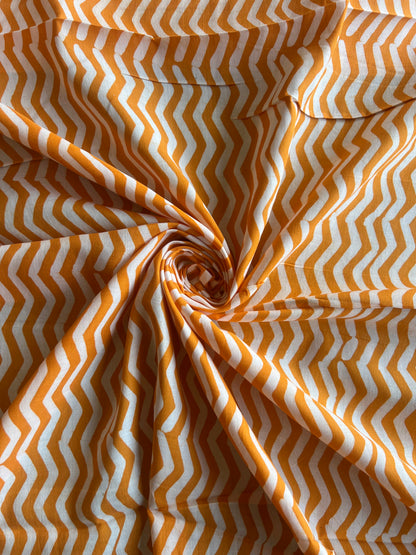 Mustard Geometrical Printed Batik Glace Cotton Fabric